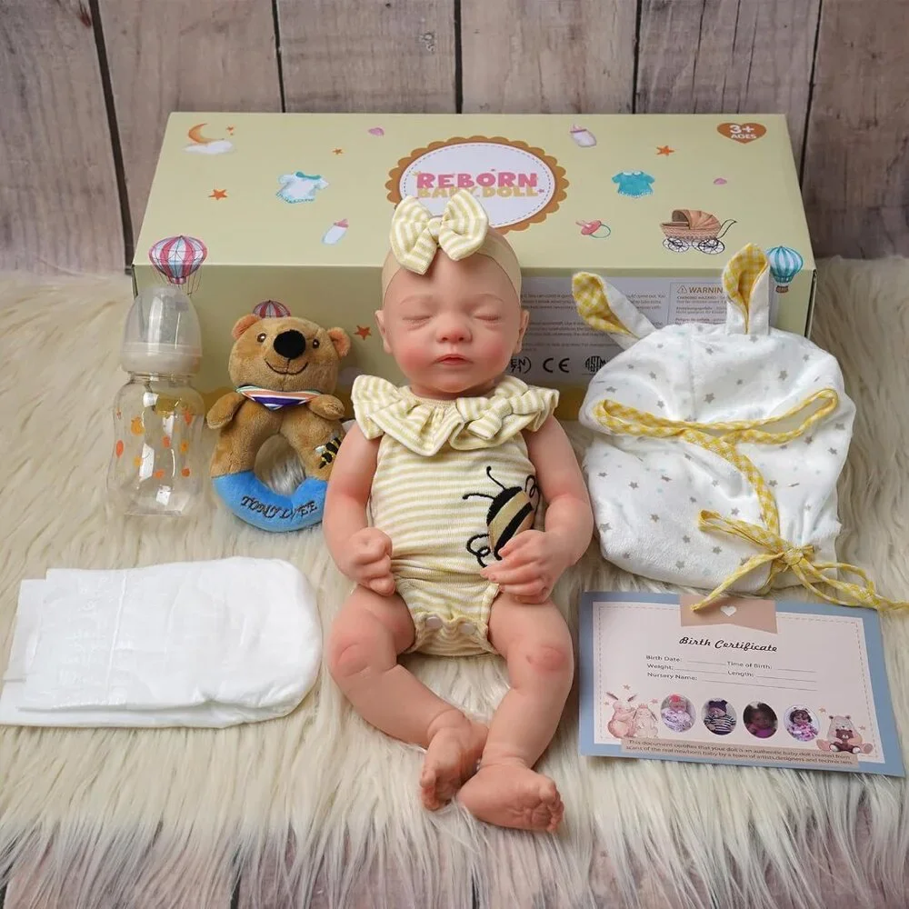 Realistic Baby Doll in Beige Knit Swaddle with Cream & Yellow Bow